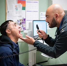 A doctor examines a patient