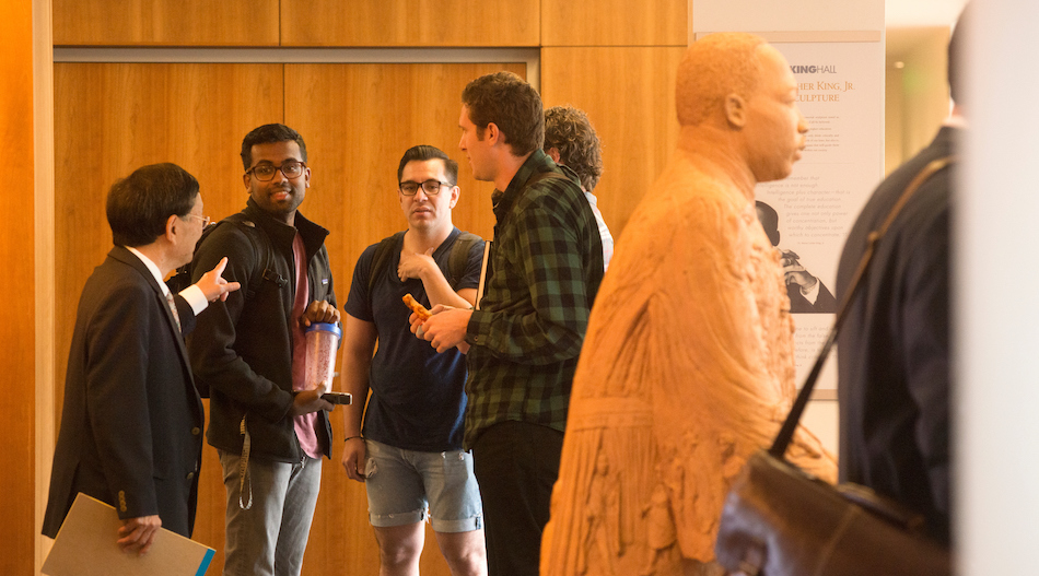 Law School students in the hall between classes talk with faculty at the UC Davis School of Law. (Gregory Urquiaga/UC Davis)