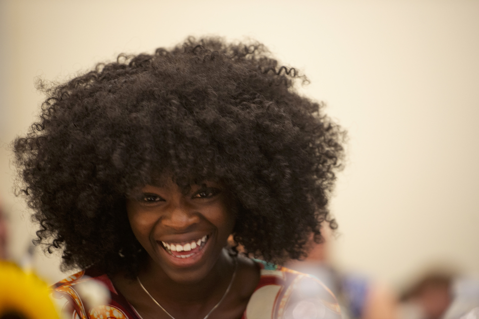 Titcho Farima Kone Kito of Burkino Faso laughs for Zidong Li's speech during the International Student Graduation Celebration on June 14. 2018. (Gregory Urquiaga/UC Davis)