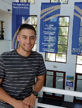 managerial eocnomics and communication major Brandon Padilla at the UC Davis Alumni Center