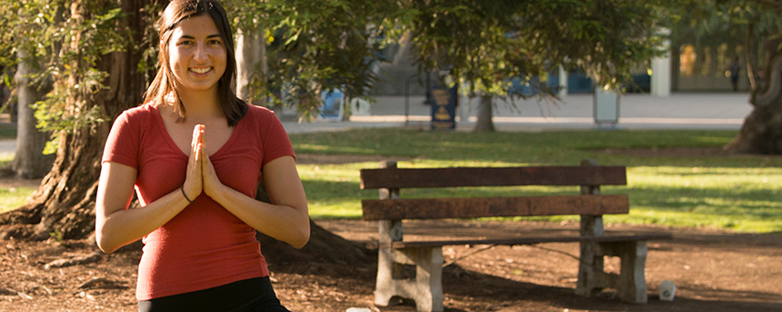 Fulbright award winner Ana Skomal in a yoga pose outdoors