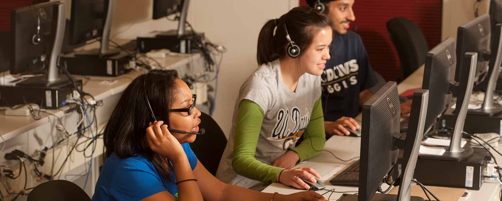 two women and a man at a call center