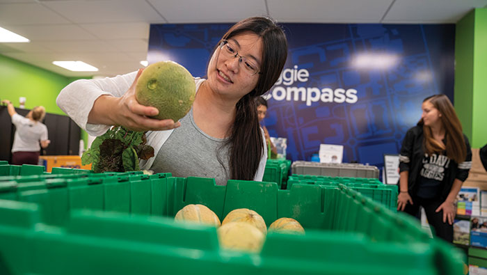 Kathleen Luo picks out produce