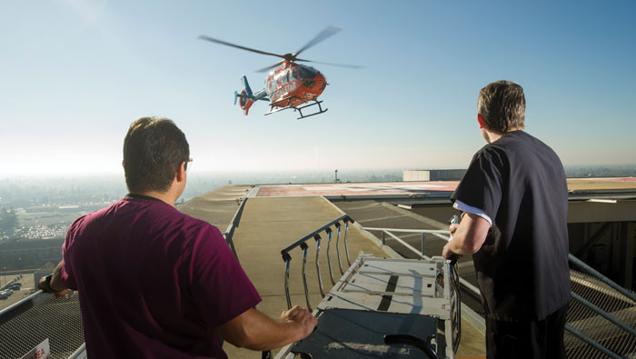 A Life Flight helicopter approaches the medical center roof