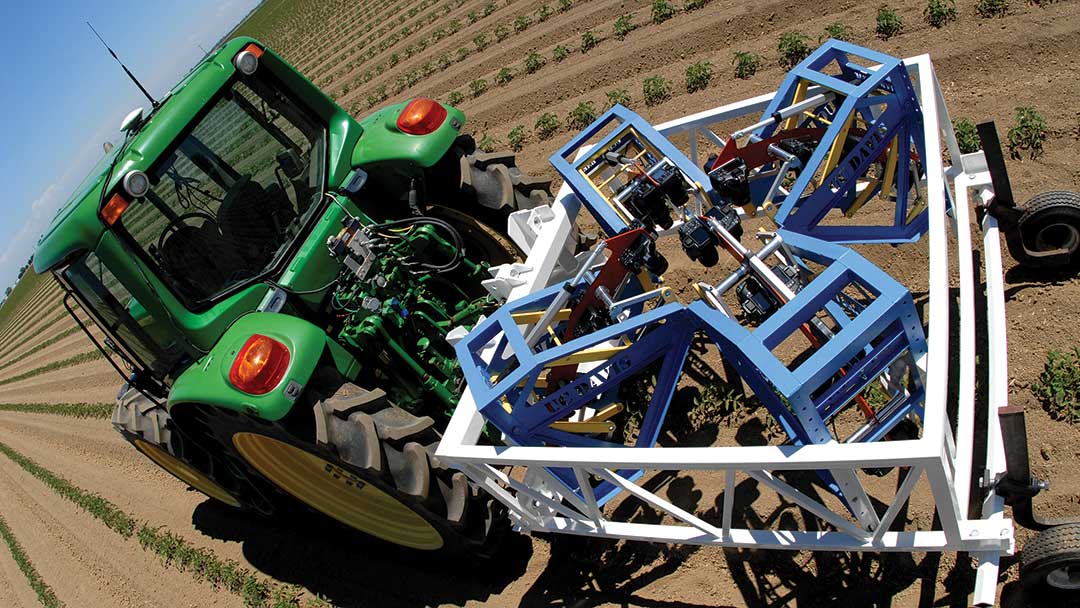 Tractor pulling a wireframe rig with cameras