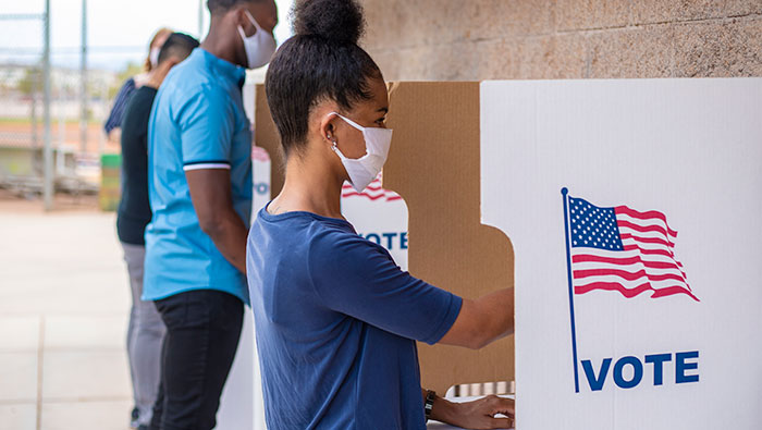 Voters voting in outdoor booths