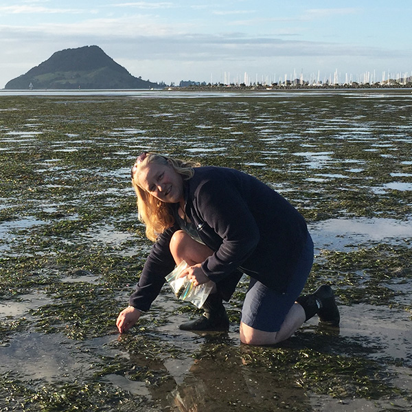 Carolyn Lundquist in a marshy area