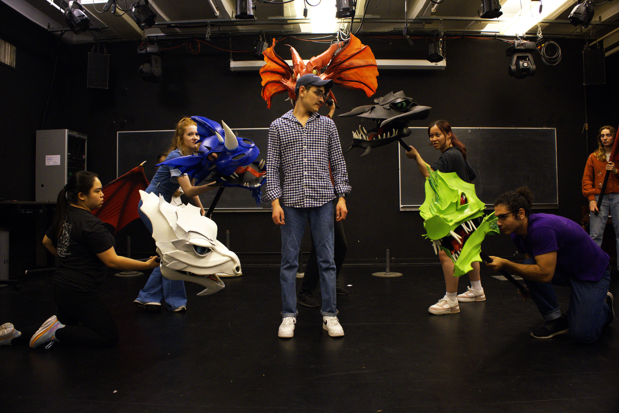 "She Kills Monsters" assistant stage manager Mario Sandoval working with performers (Photography/ Austin Wang)