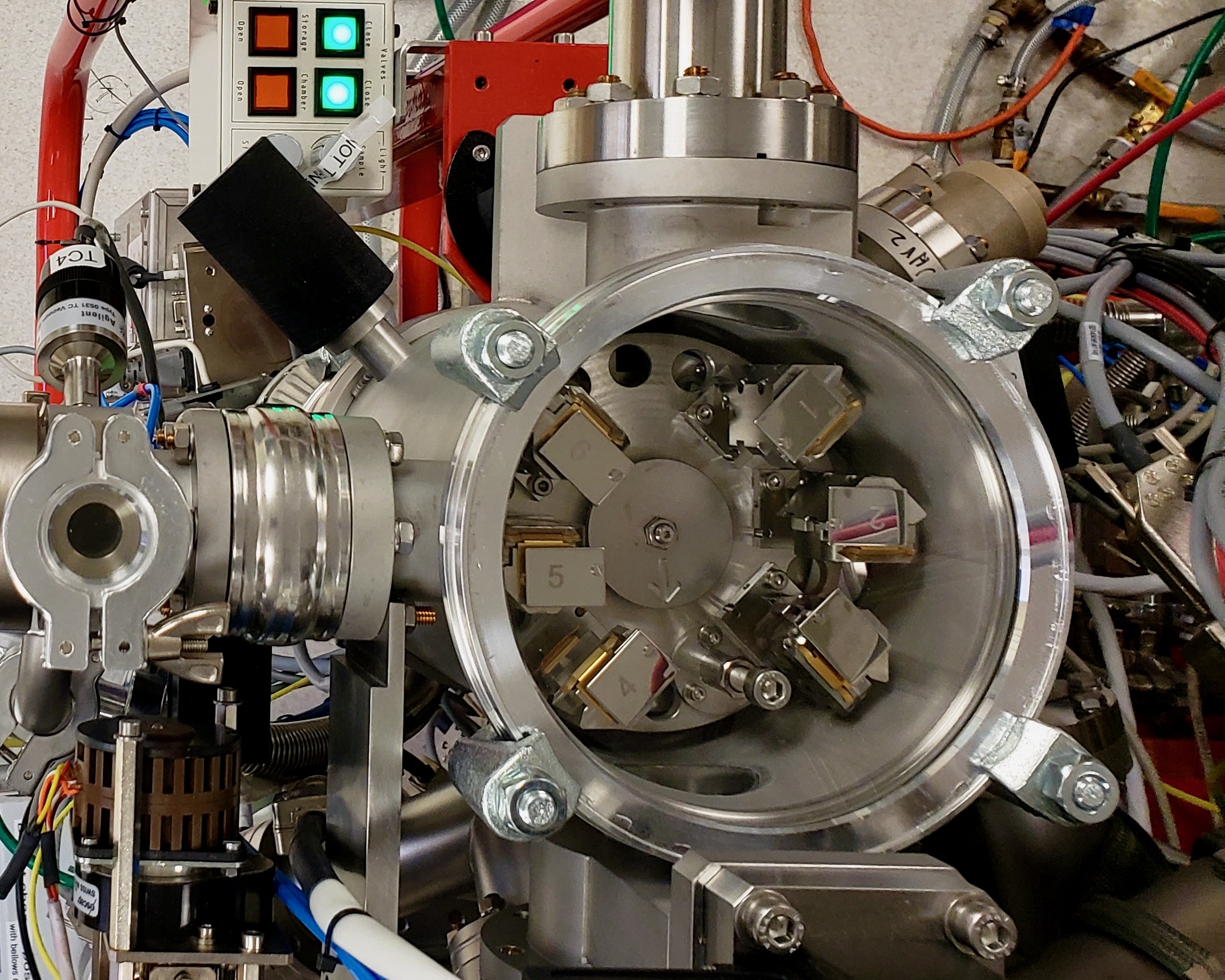 The chamber of an ion microprobe with internal rotor, valves, and wiring