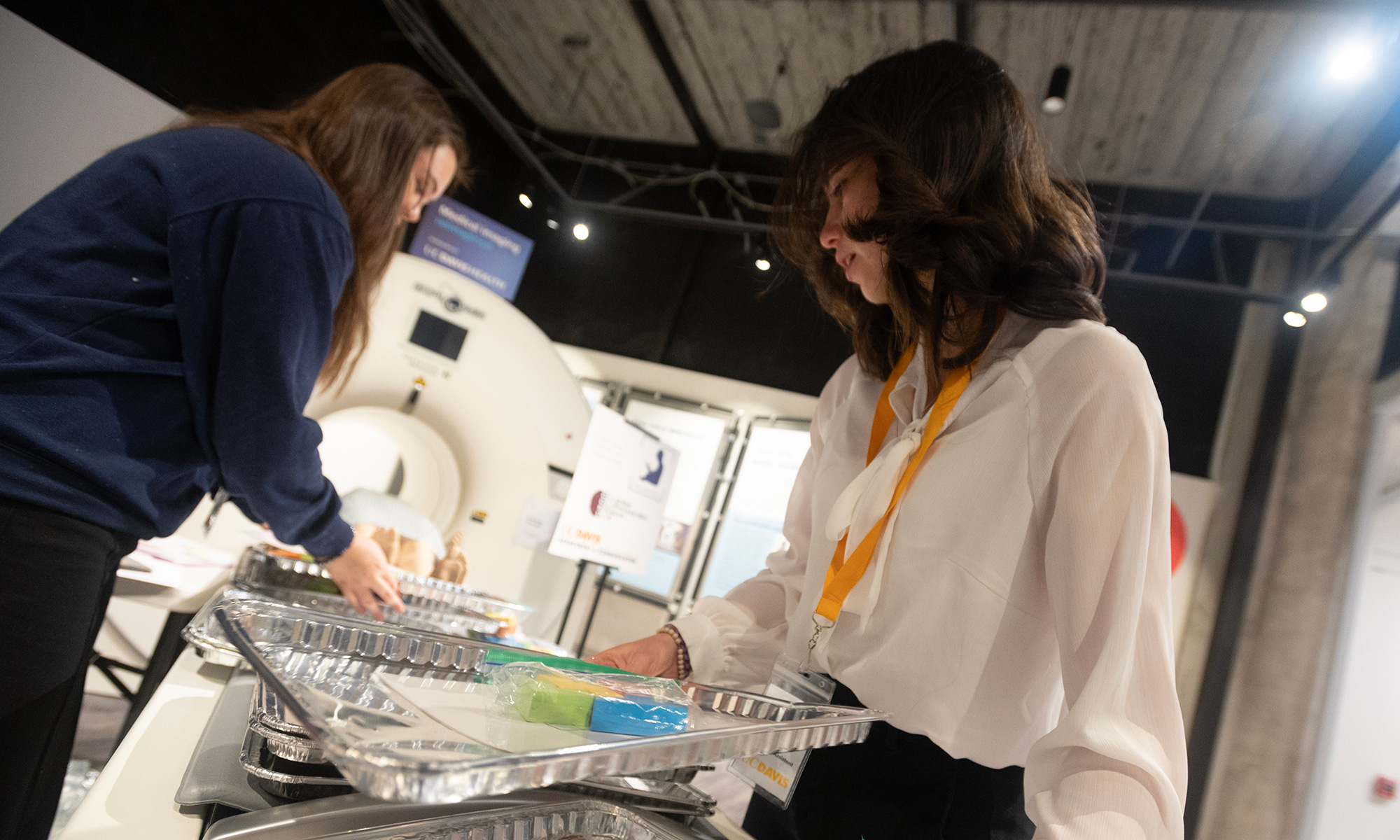 Two college students prepare for an experiment with puzzles.