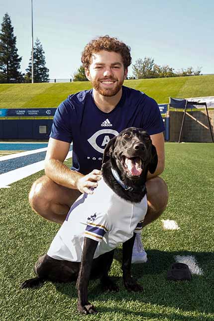 Angelo Genetti poses for a photo with Cori.