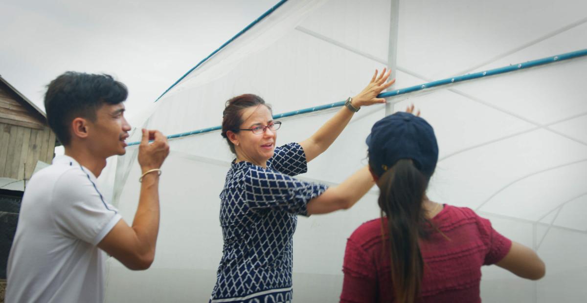 UC Davis researcher talking with Cambodians