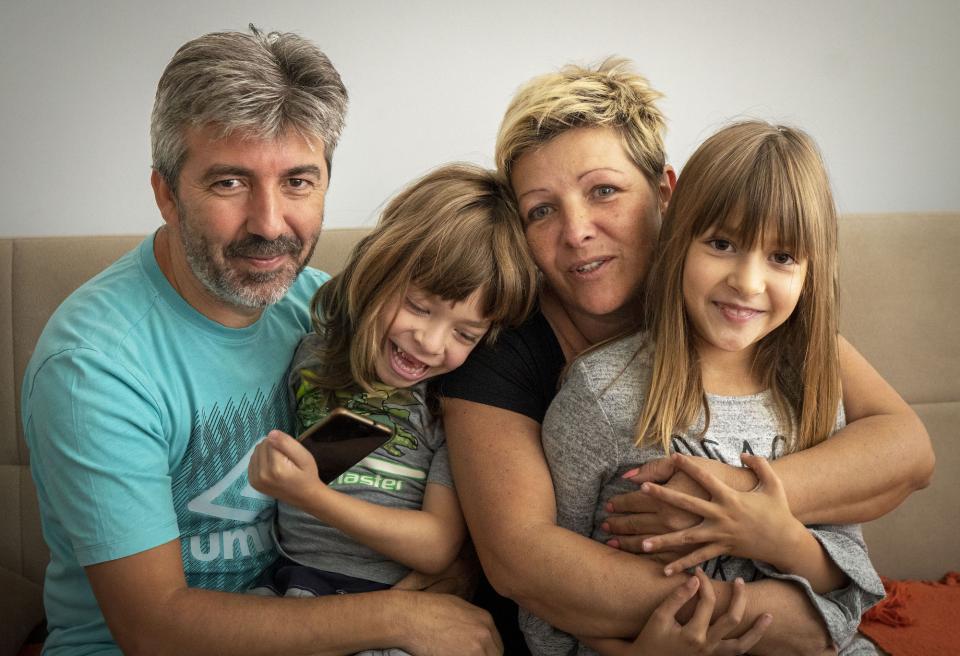 family smiling at camera