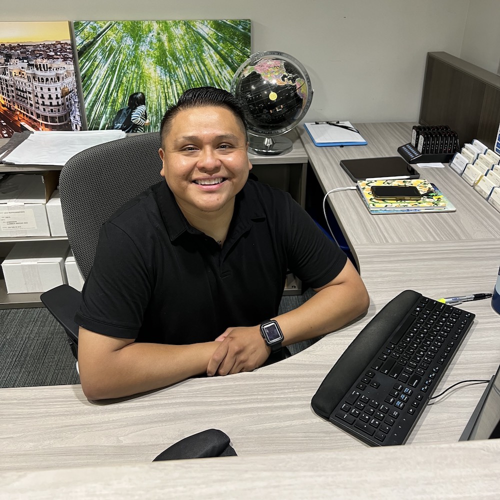 A student sits at his on-campus job at the Global Learning Center at UC Davis. 