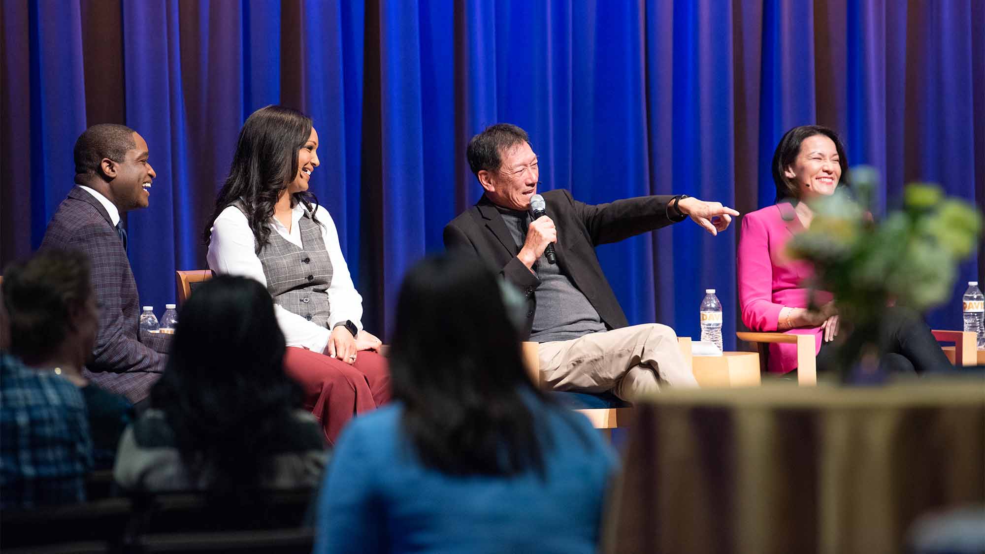 Lonnie Wong gestures while speaking on panel