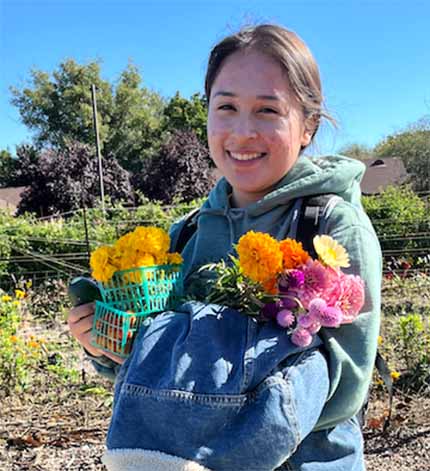 B’Elanna Pho holds flowers