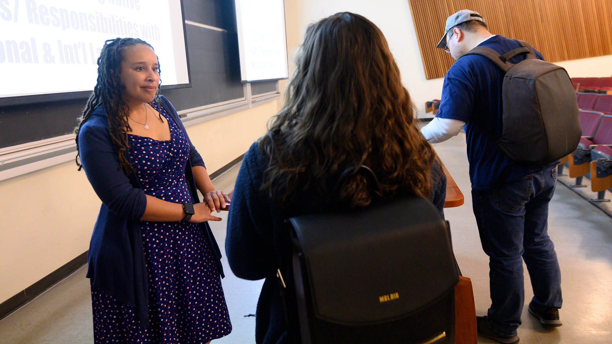 student professor meeting classroom