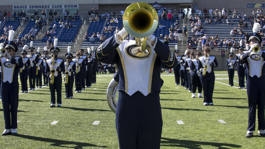 Mellophone player, on field with the Band-uh