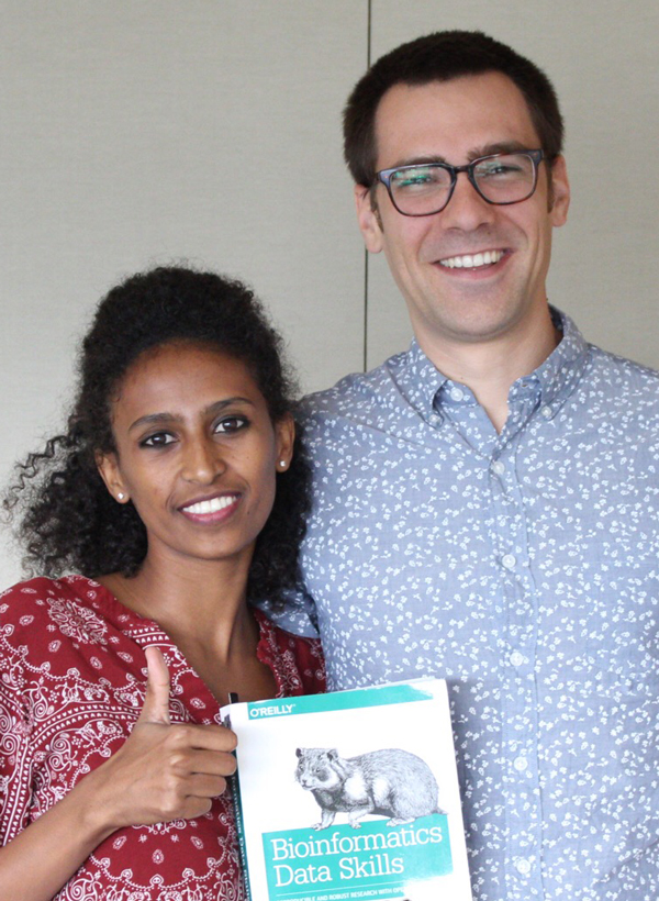 Woman and man with book