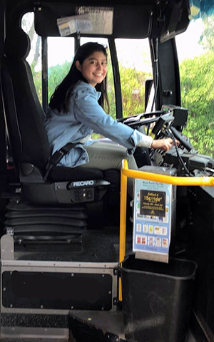 Christina Roldan driving a Unitrans bus.