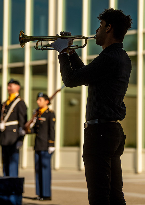 Nazil Luqman plays taps