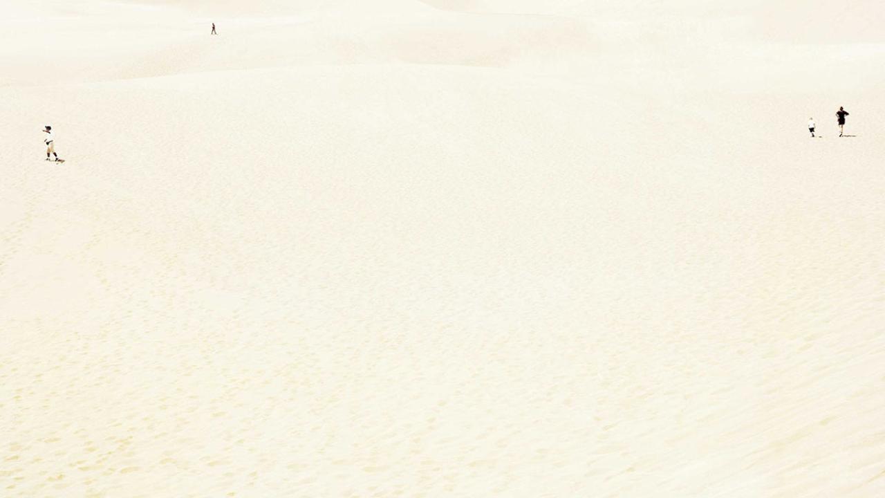 Book cover, cropped, shows tiny people.