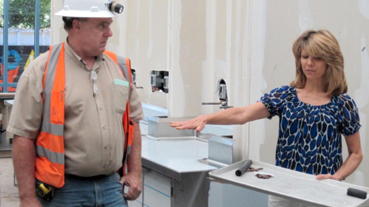 Photo: Coffee House Director Sharon Coulson and construction superintendent Jeff Brown of Sacramento's Tricorp Construction Inc. at the Swirlz island.