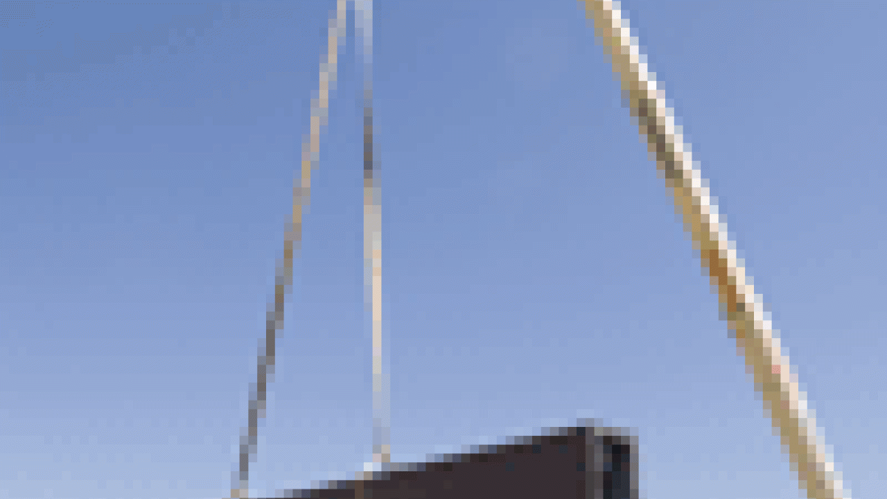 A crane lowers the Morris Fountain&acirc;s crossbeam into place as workers prepare to bolt it to the concrete pillars on July 27. Water will shoot up pipes in the columns, then fall in a sheet&acirc;like a theatre curtain&acirc;from the crossbeam. 