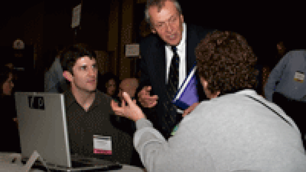 At the World of Ideas Cafe: UC President Bob Dynes is flanked by graduate student Dan MacDonald and Folsom Lake College Professor Alice Textor, as they discuss residential carbon emission reduction.