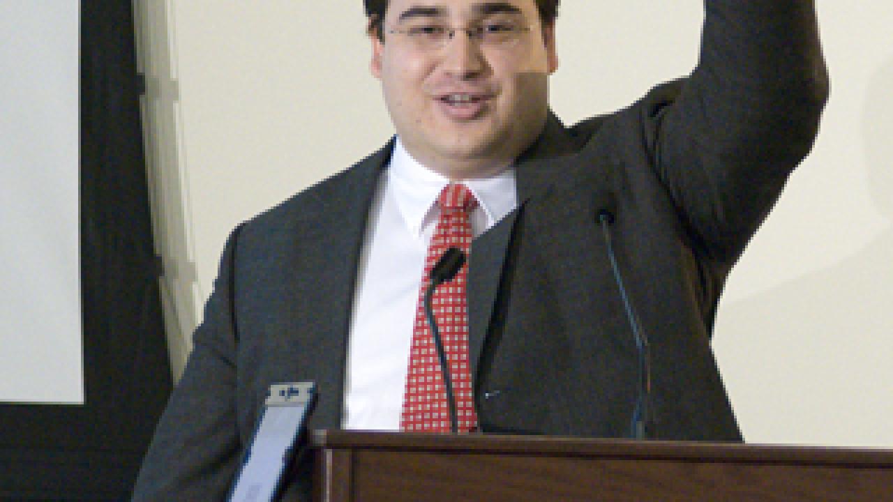 John-Paul Farsight, an MBA student, holds up a fuel cell at annual Big Bang Business Plan Competition. His ECO Catalytics team won second-place and the People's Choice Award for developing a technology that reduces the amount of expensive platin