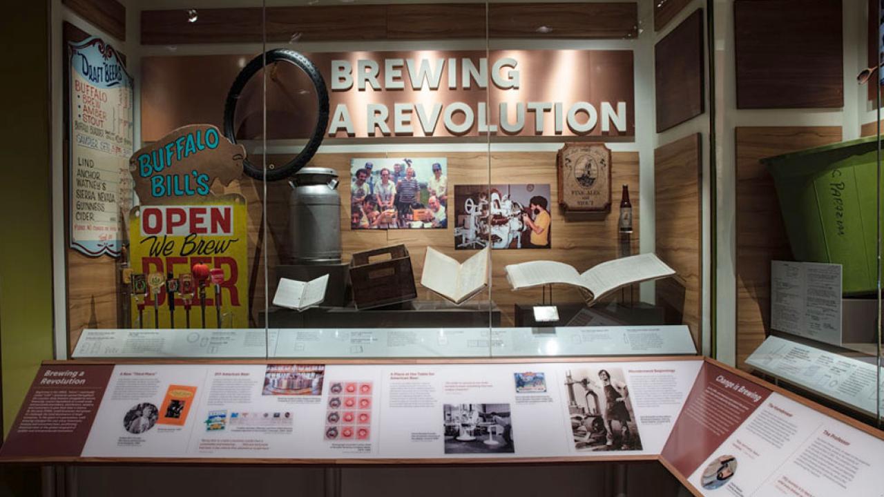 Display case with "Brewing a Revolution" title, along with artifacts.