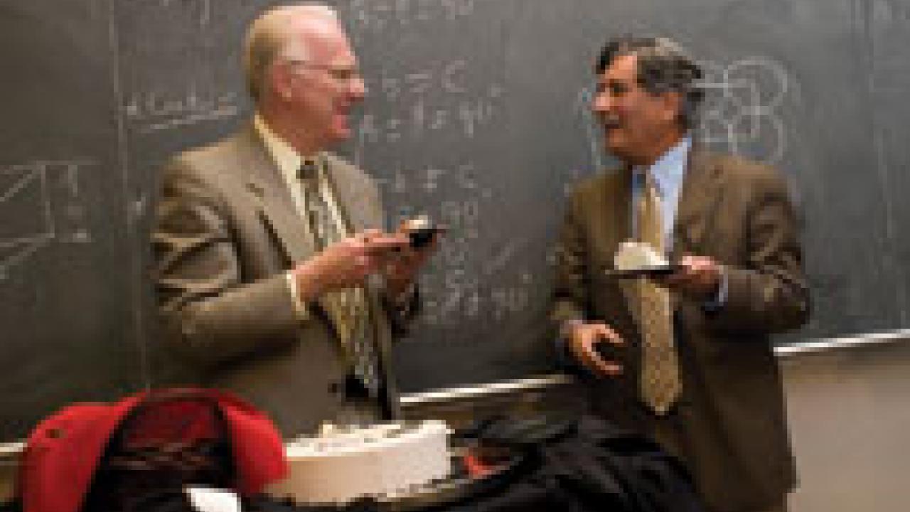 Chancellor Larry Vanderhoef, left, shares some laughs and cake with Professor Zuhair Munir, who was chosen for the 2007 UC Davis Prize for Undergraduate Teaching and Scholarly Achievement. 