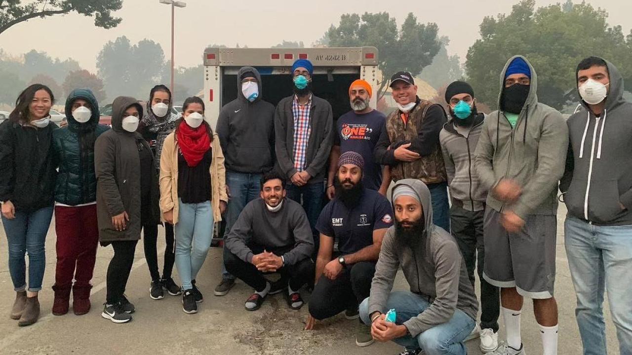 Members of the UC Davis Sikh Cultural Association wearing smoke masks.