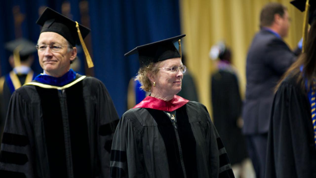 Professor Doug Nelson and Vice Provost Mau Stanton at commencement.