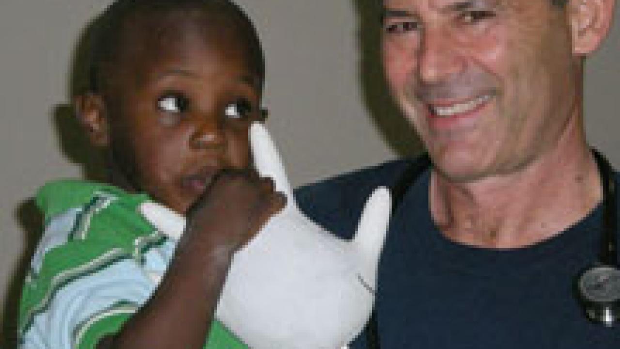 Doug Gross, right, and one of his Haitian patients.