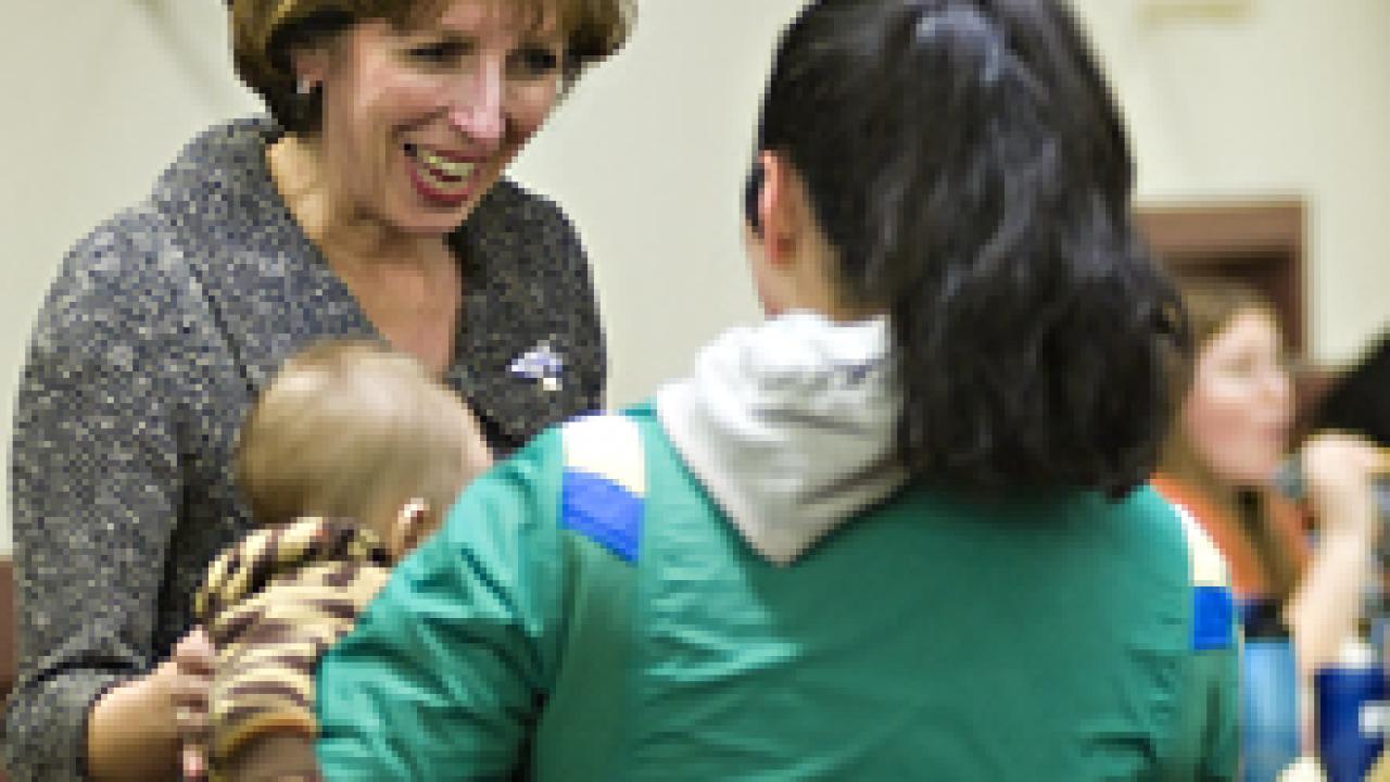 Chancellor Linda Katehi talks with graduate student Brook Colley at the Graduate Student Association's meeting on Jan. 6.
