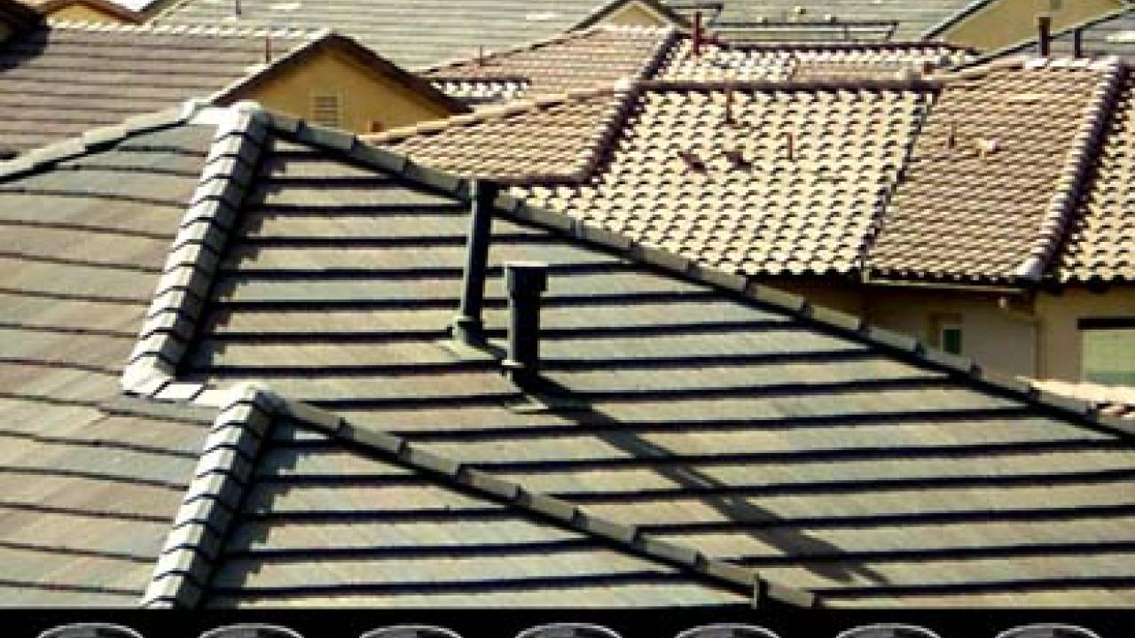 Gerald Clarke Jr. juxtaposes tract housing and Native American baskets in this work.