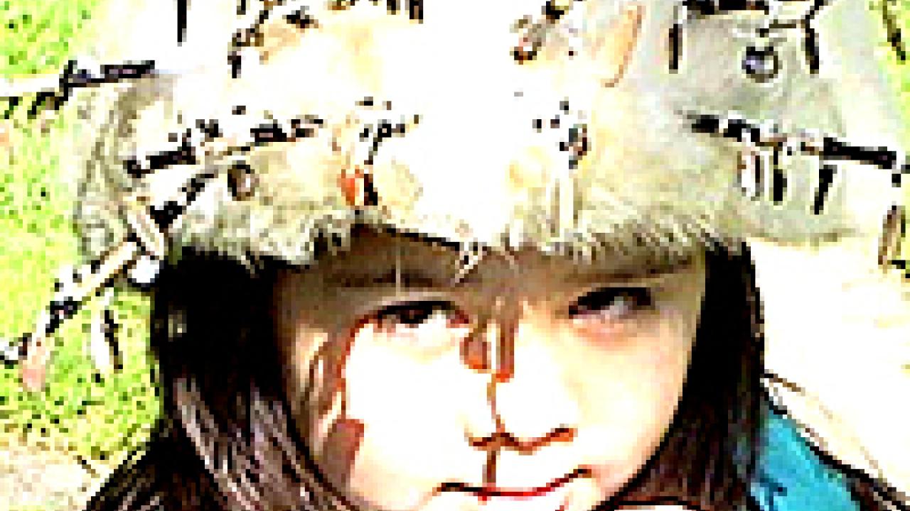 Photo: Little girl in Indian head garb