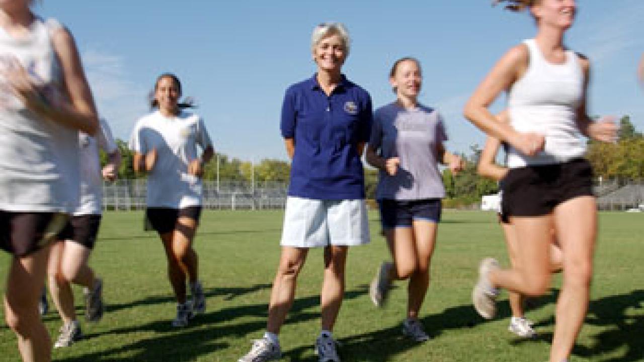 Sue Williams with her cross-country team