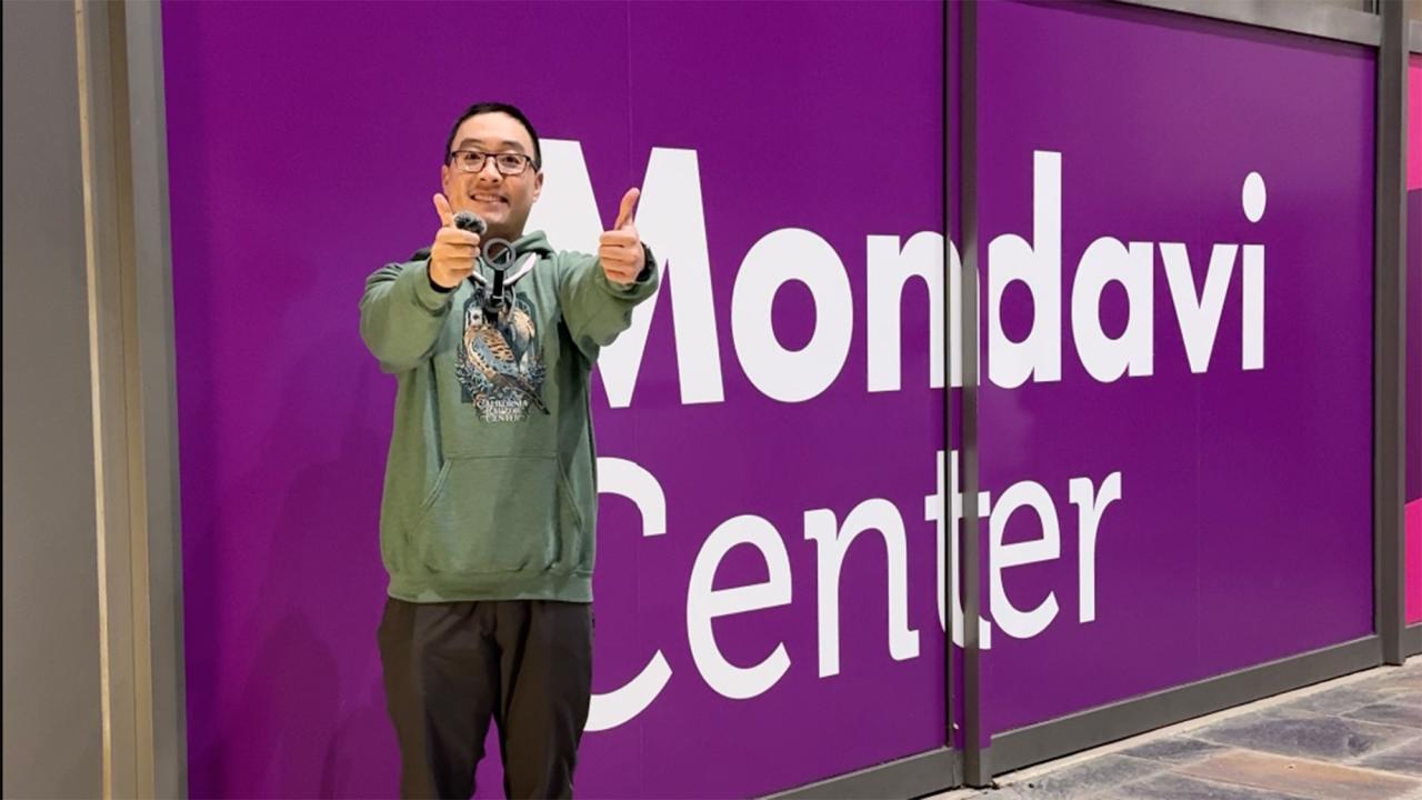 Man gives two thumbs up outside of the Mondavi Center at UC Davis