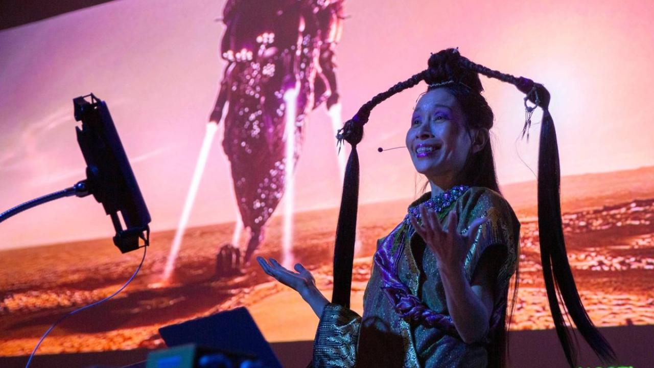 "Asian futures, without Asians" by artist Astria Suparak showing artist in front of projected image (Courtesy, Mondavi Center)