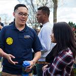 students talking to a staff member at Discover UC Davis