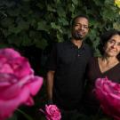 Bruce D. Haynes and Syma Solovitch, in garden flowers in foreground
