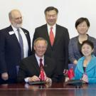 Photo: Signing ceremony, with Ralph J. Hexter, Liu Jinghui and others