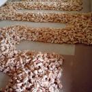 ... and Maisee Lor's clay path artwork is on the floor at the Craft Center Gallery.