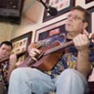 Spanish department faculty members Charles Oriel, right, and Travis Bradley perform with their band, Black Cat Bone, at the Sacramento Brewing Company in Sacramento on Dec. 9. 