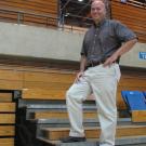 Matt Fucile stands below the concrete wall that workers will cut through through to allow for aisles from the floor to the upper concourse.