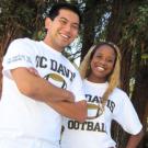 Photo: Students and bookstore employees Sam Gozun and Chynne Pharr model the football shirts with sleeve lettering that notes the Sept. 4 game.