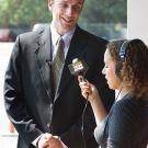 Photo: Michael Kleeman talking to reporter Nikki Modero