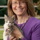 Veterinarian Julie Meadows and a kitten, pictured outside the Community Practice for Small Animals.